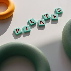 Quiet yoga studio interior with soft mint lighting.